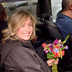 Bride leaving Uber vehicle