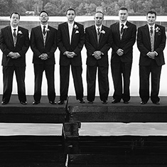 Wedding pond view of groomsmen