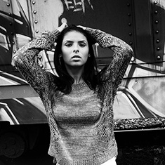 High school portrait with graffiti in background