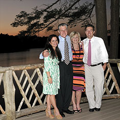 Family portrait by a lake