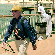 Man walking on Coney Island Boardwalk